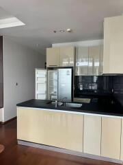 Modern kitchen with sleek black countertops and stainless steel appliances