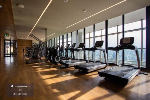 Luxury gym with modern exercise equipment and a scenic view