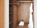 Wooden closet with shelves and hangers