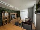 Modern living room with wooden furniture and green wall