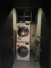 Small laundry space with stacked washer and dryer