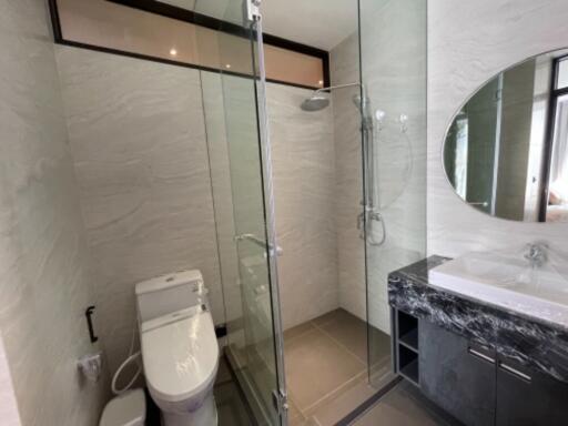 Modern bathroom with glass shower and toilet