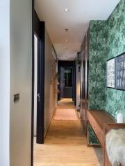 Modern hallway with wooden floor and tropical wallpaper