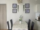 Dining room with a table set, chairs, and decorative elements