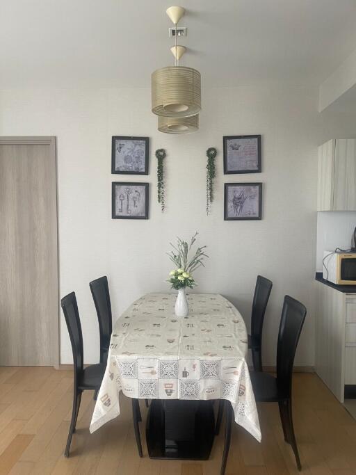 Dining room with a table set, chairs, and decorative elements