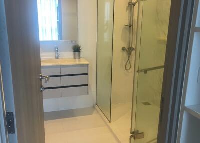 Modern bathroom with glass shower and sink