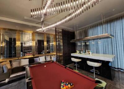 Luxurious living room with a pool table and bar area