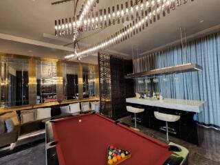 Luxurious living room with a pool table and bar area