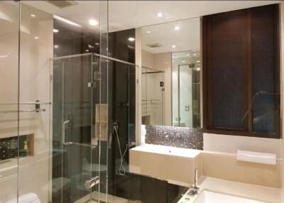 Modern bathroom with glass shower and bathtub