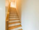 Wooden staircase in a well-lit area