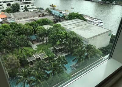 View of buildings and a river from a window