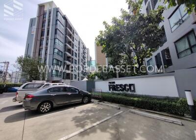 Front view of residential building with parking area