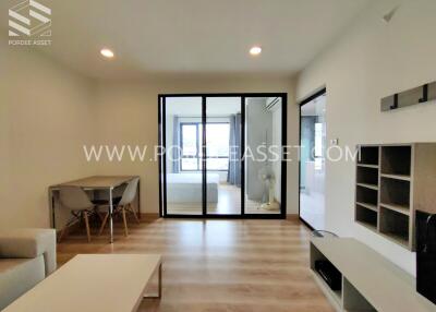 Spacious living room with modern furniture and a view into other rooms