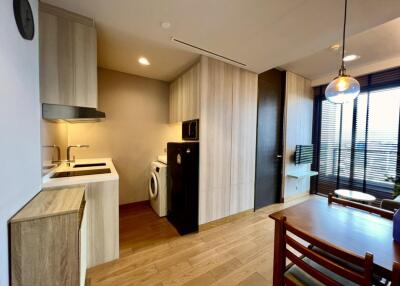 Modern kitchen and dining area with appliances