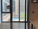 Modern living area with large glass windows and city view