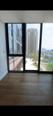 Modern living room with large windows and a city view