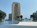 View of high-rise building with a swimming pool in the foreground