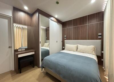 modern bedroom with wooden accents and ample lighting