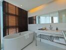 Modern bathroom with freestanding tub and sleek design