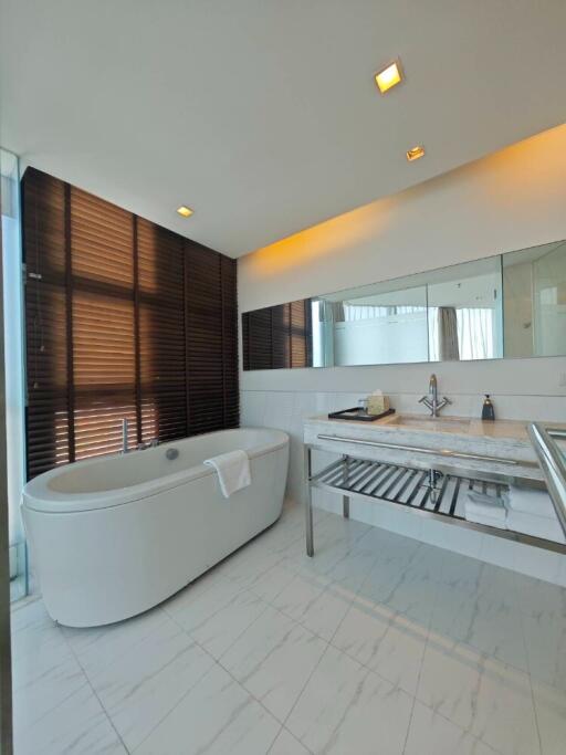 Modern bathroom with freestanding tub and sleek design