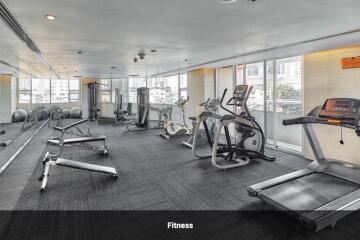 Modern fitness room with various exercise equipment