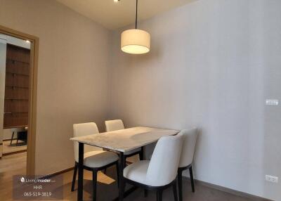 Modern dining area with a table and four chairs