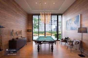 Luxurious room with pool table and large windows