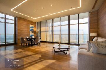 Modern living room with dining area and large windows