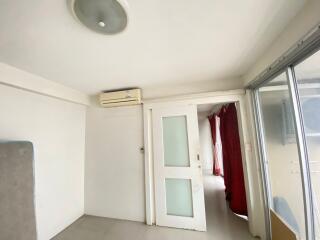 Bedroom with sliding door and window