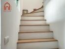 Minimalist indoor staircase with wooden steps