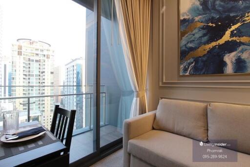 Living room with a view of the city and balcony access