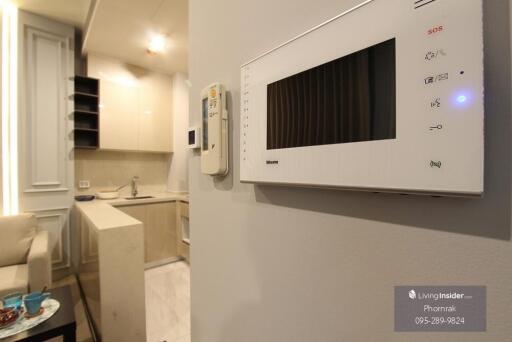 Modern kitchen with integrated appliances and control panel