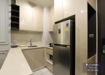 Modern kitchen with stainless steel appliances and sleek cabinets