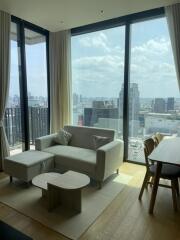 Modern living room with large windows and city view