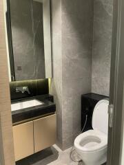 Modern bathroom with marble tiles and built-in sink