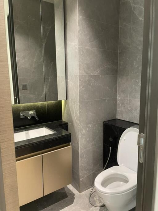 Modern bathroom with marble tiles and built-in sink