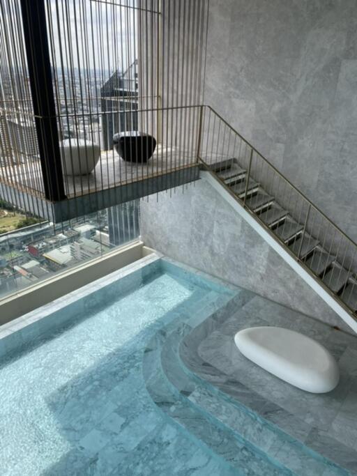 Modern indoor pool with city view