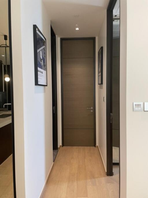 Modern hallway with wooden floor and minimalistic design