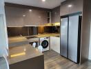 Modern kitchen with integrated appliances and breakfast bar