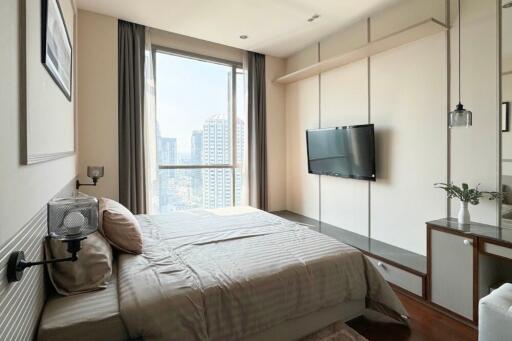 Modern bedroom with large window and natural light