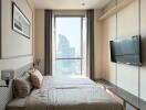 Modern bedroom with large window and city view