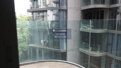 Outdoor balcony view of adjacent modern residential building