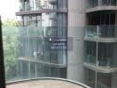 Outdoor balcony view of adjacent modern residential building