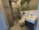 Modern bathroom with large mirror and glass shower enclosure