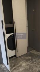 Laundry area with modern appliances