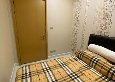 Bedroom with double bed and door