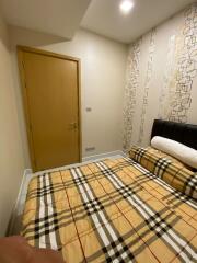 Bedroom with double bed and door