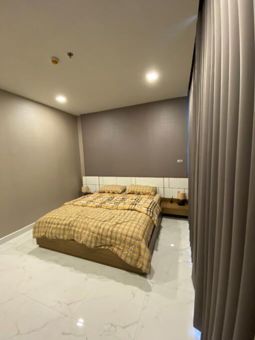 Modern bedroom with a checkered bedspread