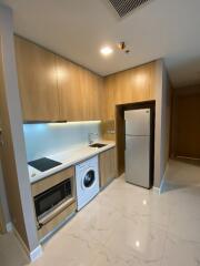 Modern kitchen area with integrated appliances