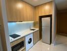 Modern kitchen area with integrated appliances